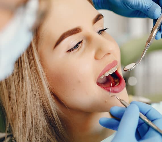 Smiling patient at Sam's Family Dental Jackson Heights
